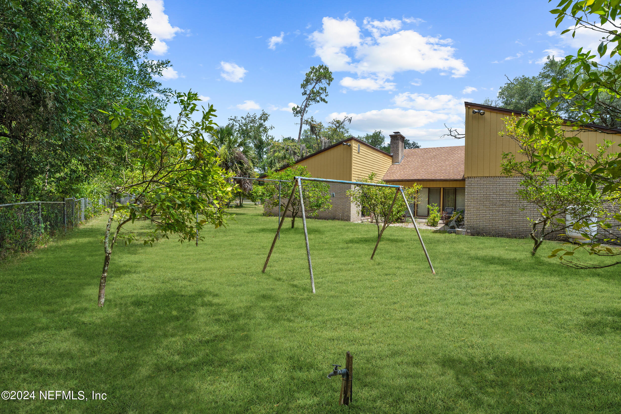8080 Ibach Road Jacksonville, FL 32216 - Photo 7 of 34 a view of a house with a backyard