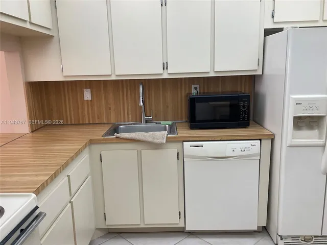 a kitchen with a stove and a refrigerator