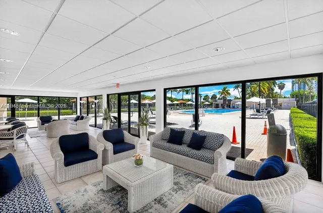 a view of living room filled with furniture and rug