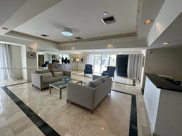 a view of a chair and table in the garden