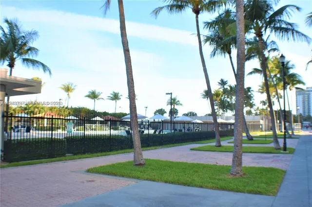 a view of a swimming pool and lounge chairs