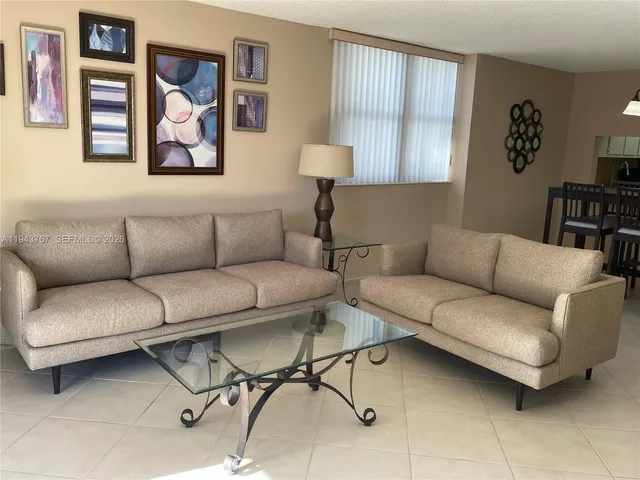 a living room with furniture and a couch