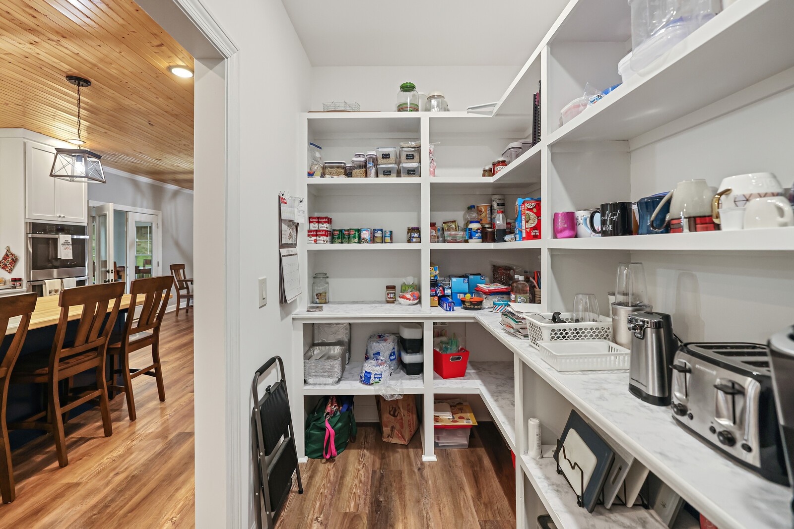 2095 Linwood Road Watertown, TN 37184 - Photo 18 of 52 a storage room with stainless steel appliances lots of wooden furniture
