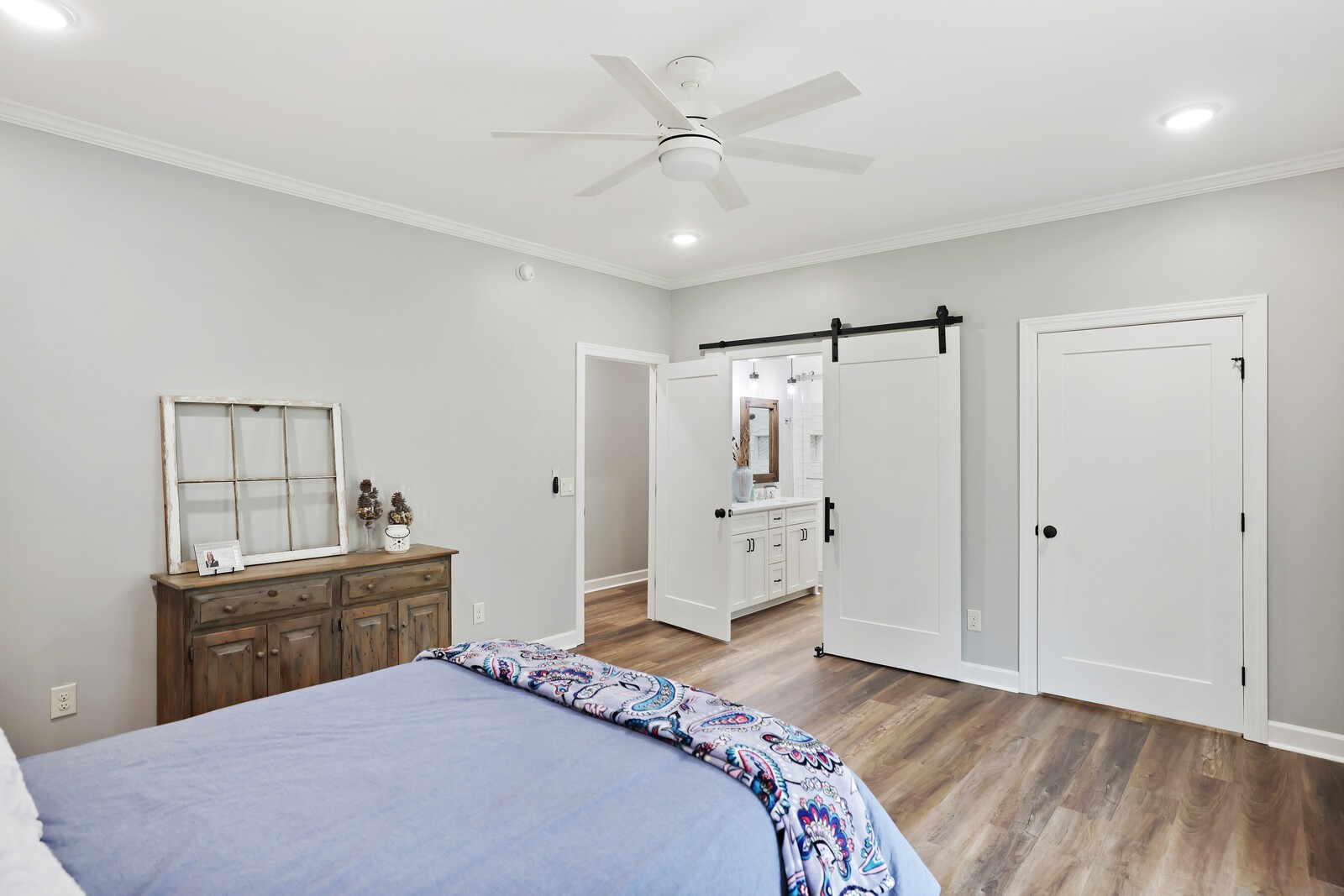 2095 Linwood Road Watertown, TN 37184 - Photo 31 of 52 a bedroom with a bed and a chandelier