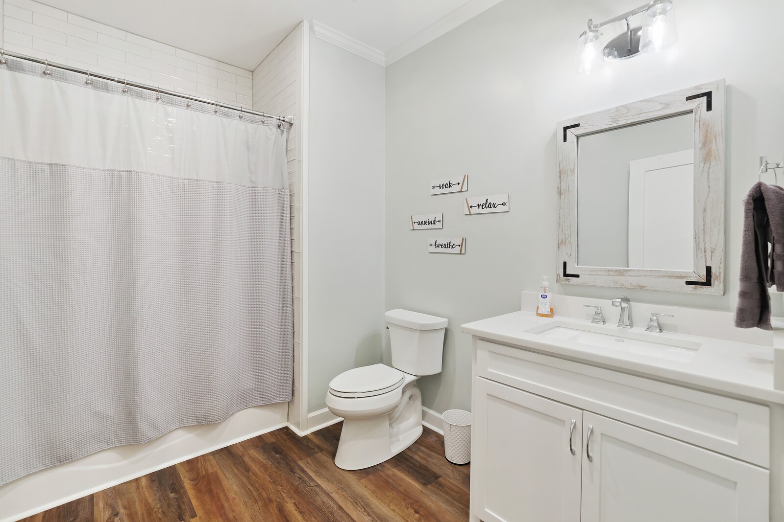 2095 Linwood Road Watertown, TN 37184 - Photo 40 of 52 a bathroom with a sink a toilet and shower curtain