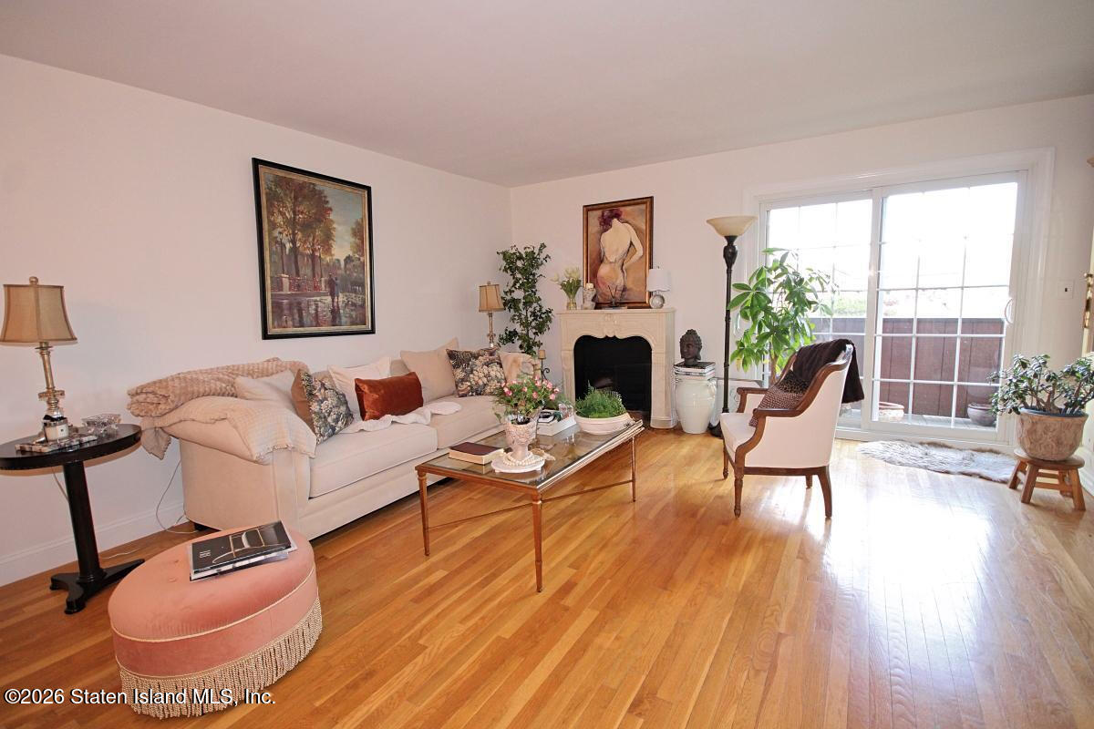951 West Fingerboard Road Staten Island, NY 10304 - Photo 2 of 29 a living room with furniture and a fireplace