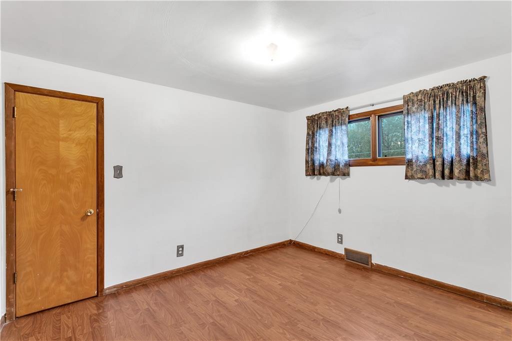 129 Shaffer Road Apollo, PA 15613 - Photo 11 of 25 an empty room with wooden floor and windows