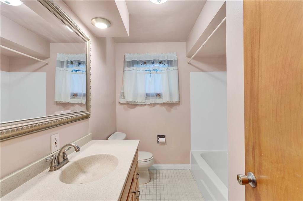 129 Shaffer Road Apollo, PA 15613 - Photo 12 of 25 a bathroom with a sink a toilet a shower and a mirror
