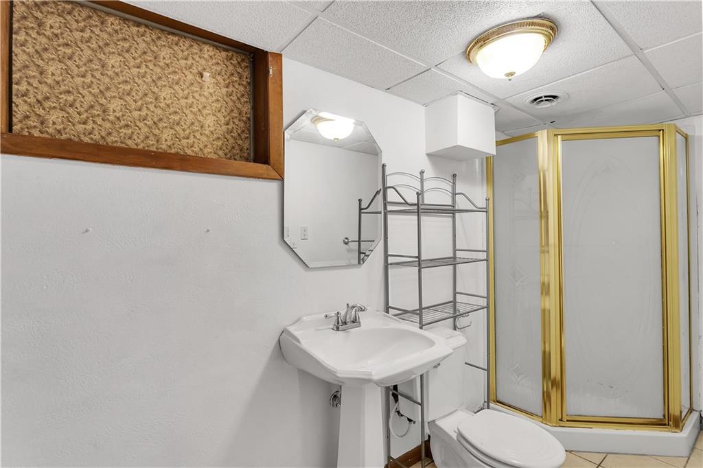 129 Shaffer Road Apollo, PA 15613 - Photo 15 of 25 a bathroom with a sink a toilet and shower