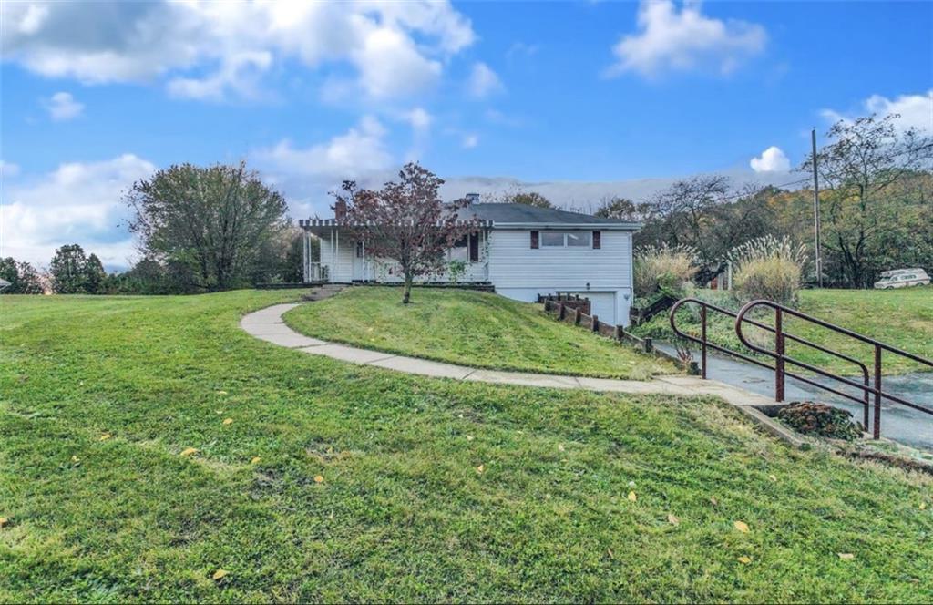 129 Shaffer Road Apollo, PA 15613 - Photo 20 of 25 a view of a garden with a house in the background