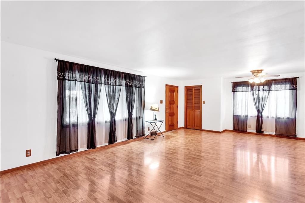 129 Shaffer Road Apollo, PA 15613 - Photo 3 of 25 a view of an empty room with wooden floor and a window