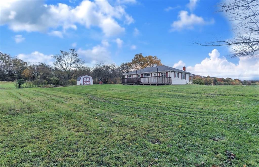 129 Shaffer Road Apollo, PA 15613 - Photo 22 of 25 a view of a big yard with a house in the background