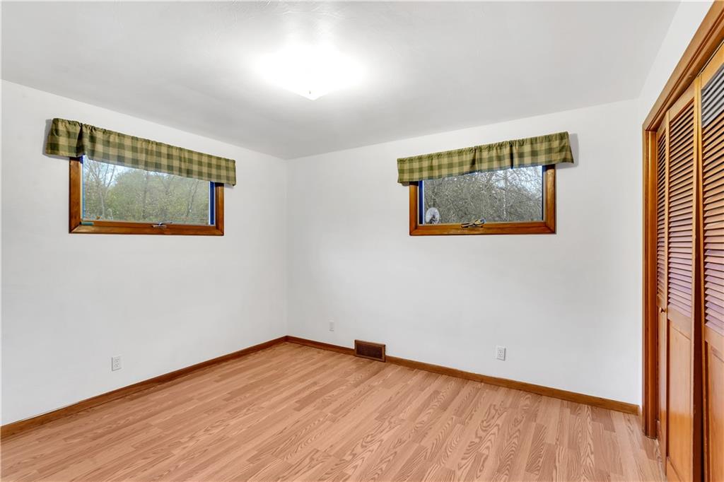 129 Shaffer Road Apollo, PA 15613 - Photo 10 of 25 a view of an empty room with wooden floor and a window