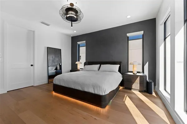 a bedroom with a bed and window