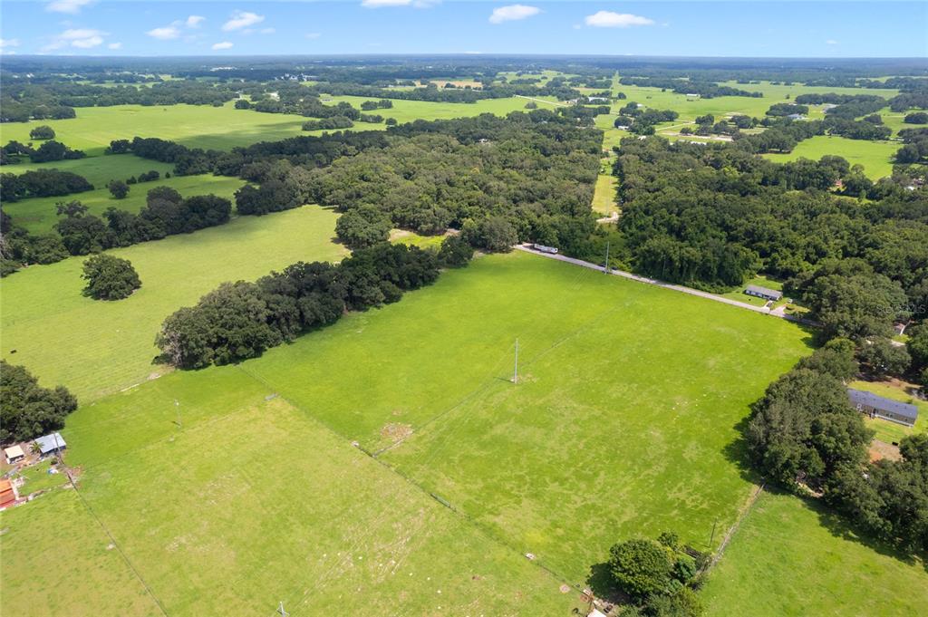 552 Cr Bushnell Bushnell, FL 33513 - Photo 15 of 21 a view of a large body of water with a building in the background
