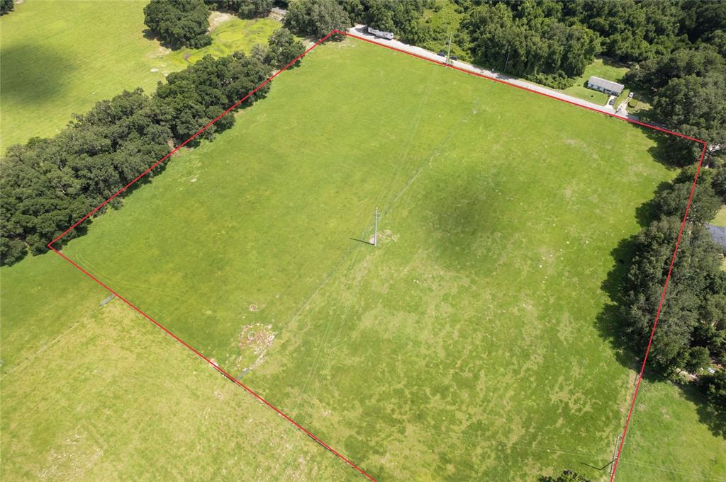 552 Cr Bushnell Bushnell, FL 33513 - Photo 17 of 21 a view of a swimming pool and an outdoor space