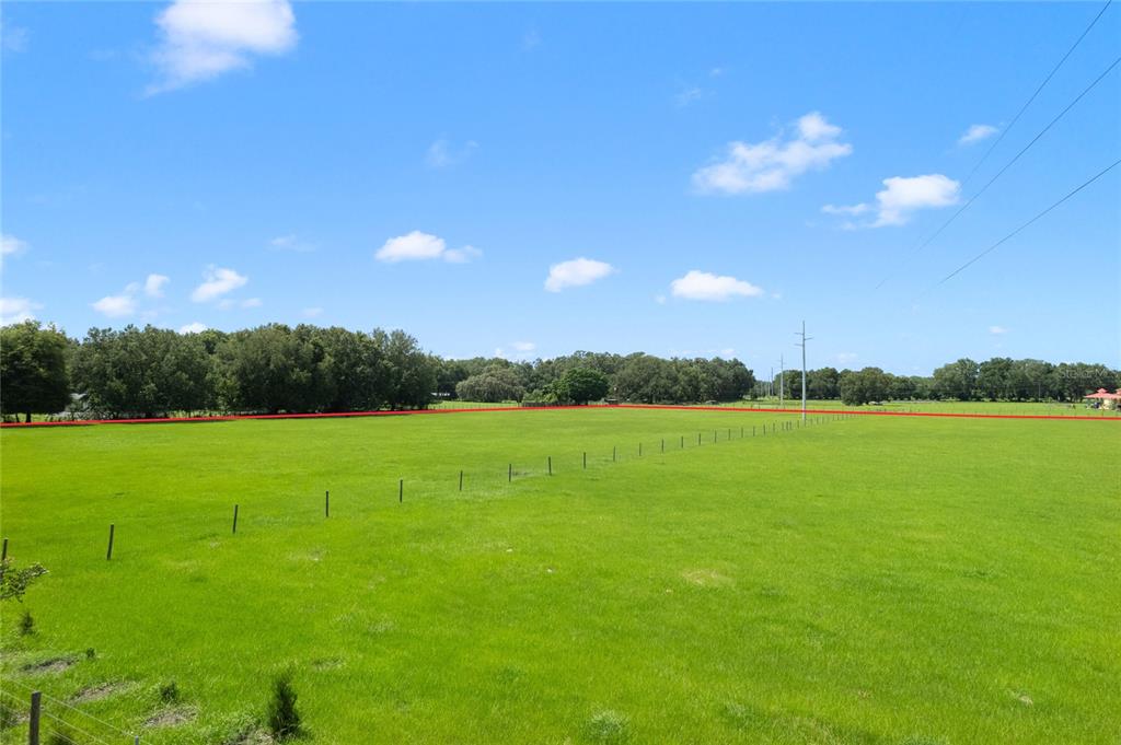 552 Cr Bushnell Bushnell, FL 33513 - Photo 21 of 21 a view of a golf course with huge green field and mountains
