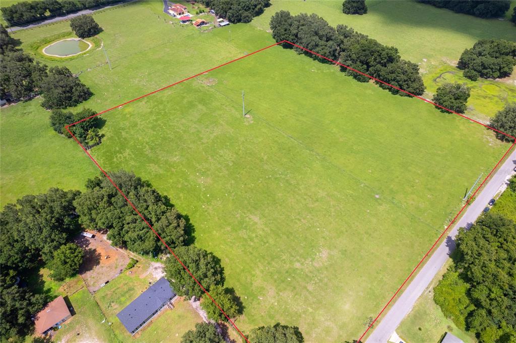 552 Cr Bushnell Bushnell, FL 33513 - Photo 6 of 21 a view of a lake with a yard