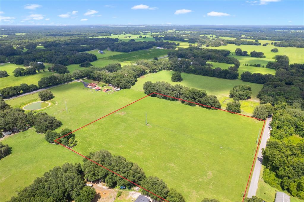 552 Cr Bushnell Bushnell, FL 33513 - Photo 7 of 21 a view of a lake with a city