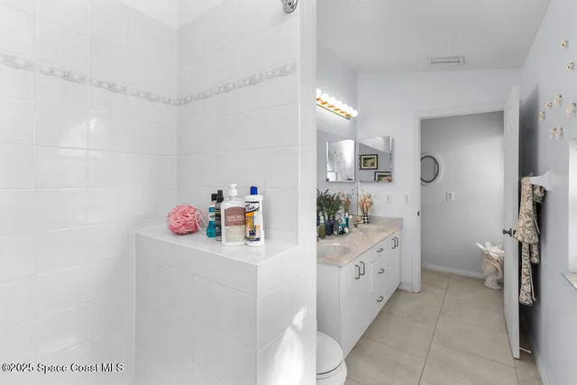 a kitchen with a sink a stove and cabinets