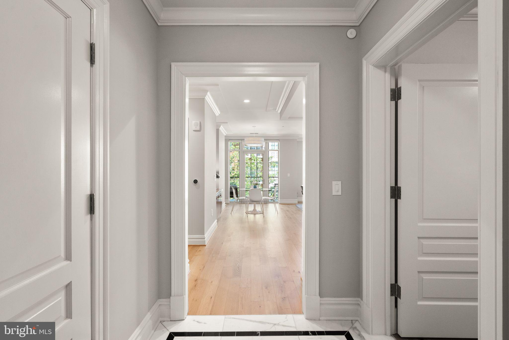 6900 Fleetwood Road, Unit 415 McLean, VA 22101 - Photo 7 of 51 a view of a hallway with wooden floor and a livingroom