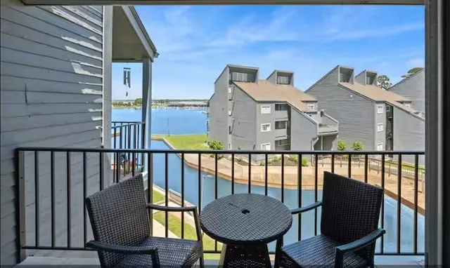 a view of a balcony with chairs