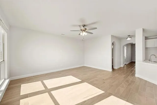 a view of an empty room with a window