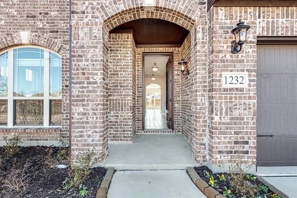 1232 Starlight Avenue Aubrey, TX 76227 - Photo 2 of 22 a front view of a house with a outdoor shower