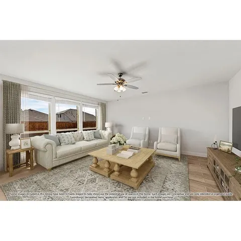 a living room with furniture and a table