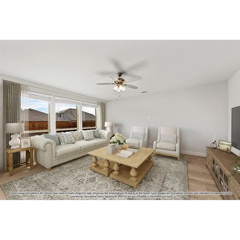 1232 Starlight Avenue Aubrey, TX 76227 - Photo 7 of 22 a living room with furniture and a table