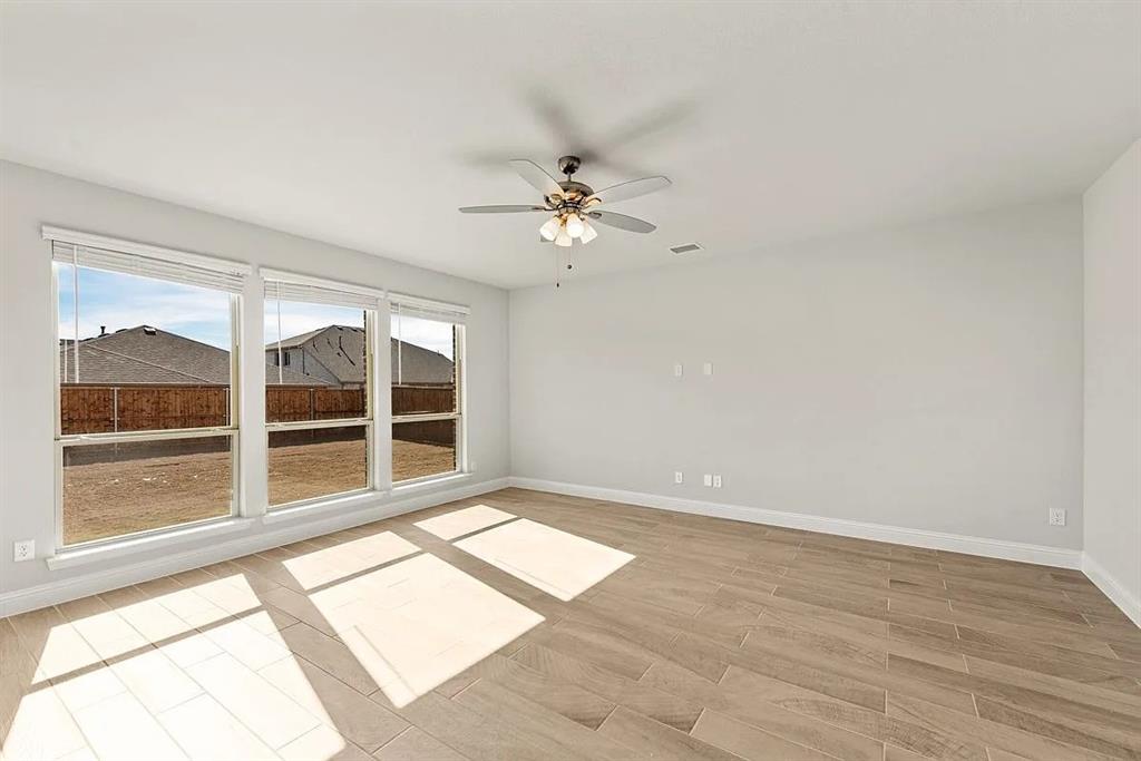 1232 Starlight Avenue Aubrey, TX 76227 - Photo 9 of 22 a view of an empty room with a window
