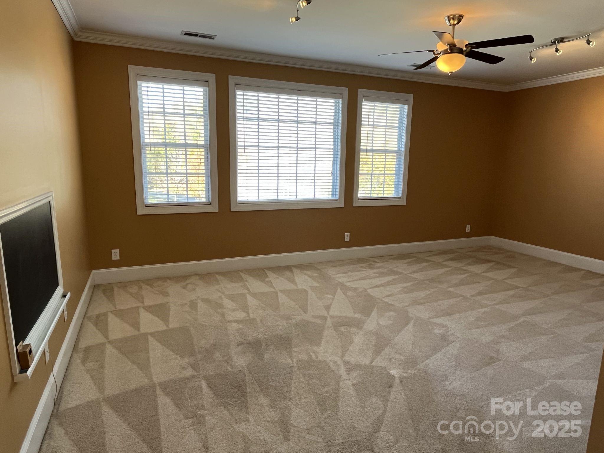 11502 Wheat Ridge Road Charlotte, NC 28277 - Photo 12 of 47 a view of an empty room with a window