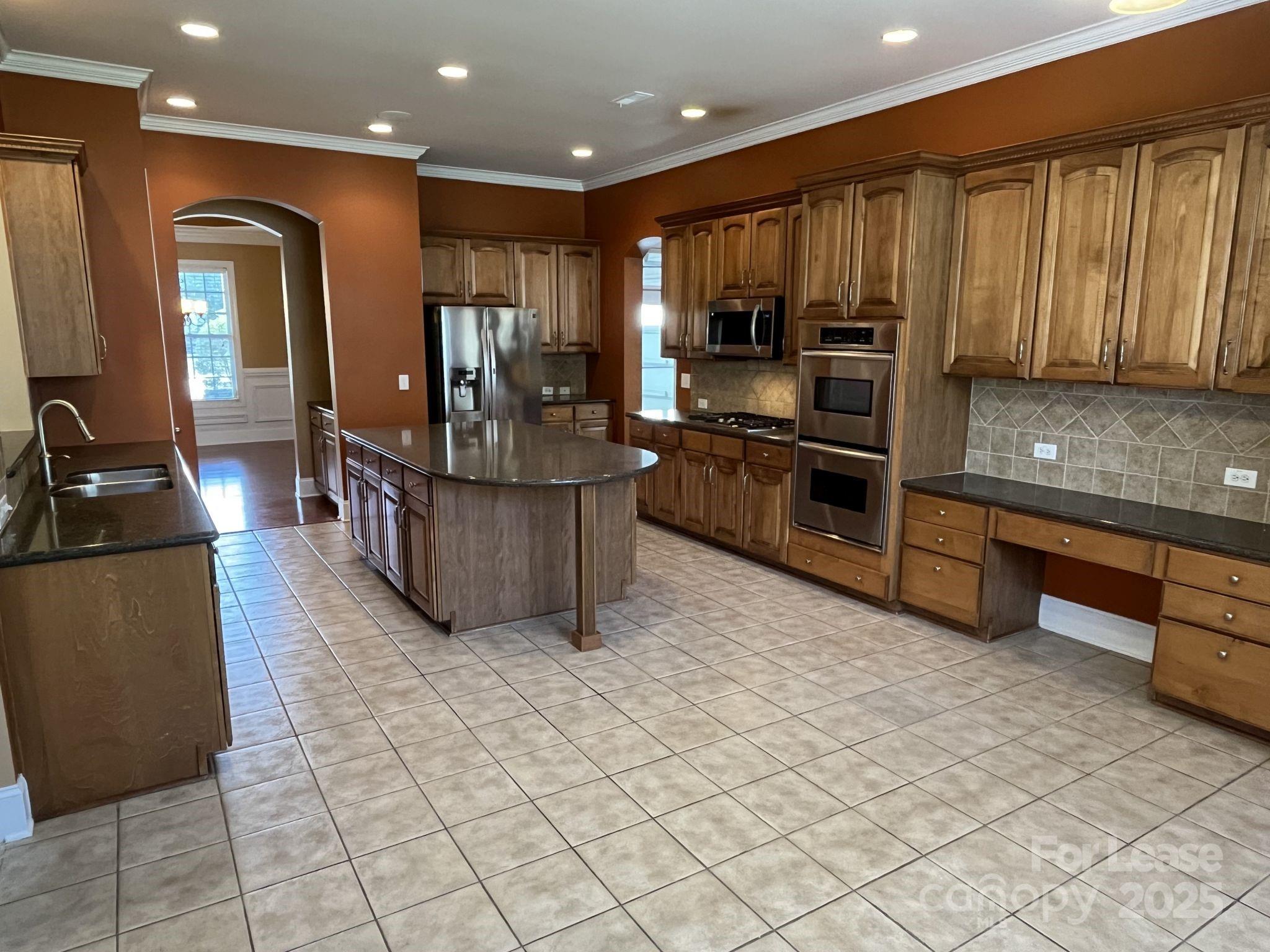 11502 Wheat Ridge Road Charlotte, NC 28277 - Photo 15 of 47 a kitchen with stainless steel appliances granite countertop a refrigerator oven a sink dishwasher and a black cabinets