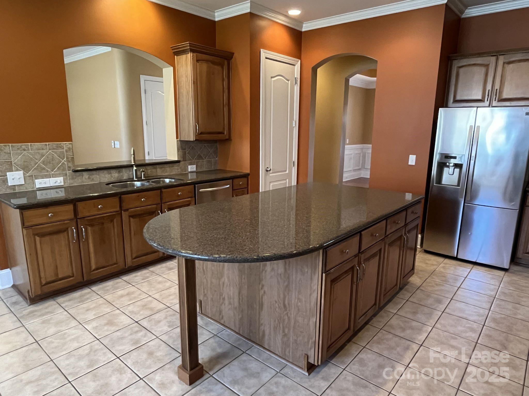 11502 Wheat Ridge Road Charlotte, NC 28277 - Photo 16 of 47 a kitchen with stainless steel appliances granite countertop a sink and a refrigerator