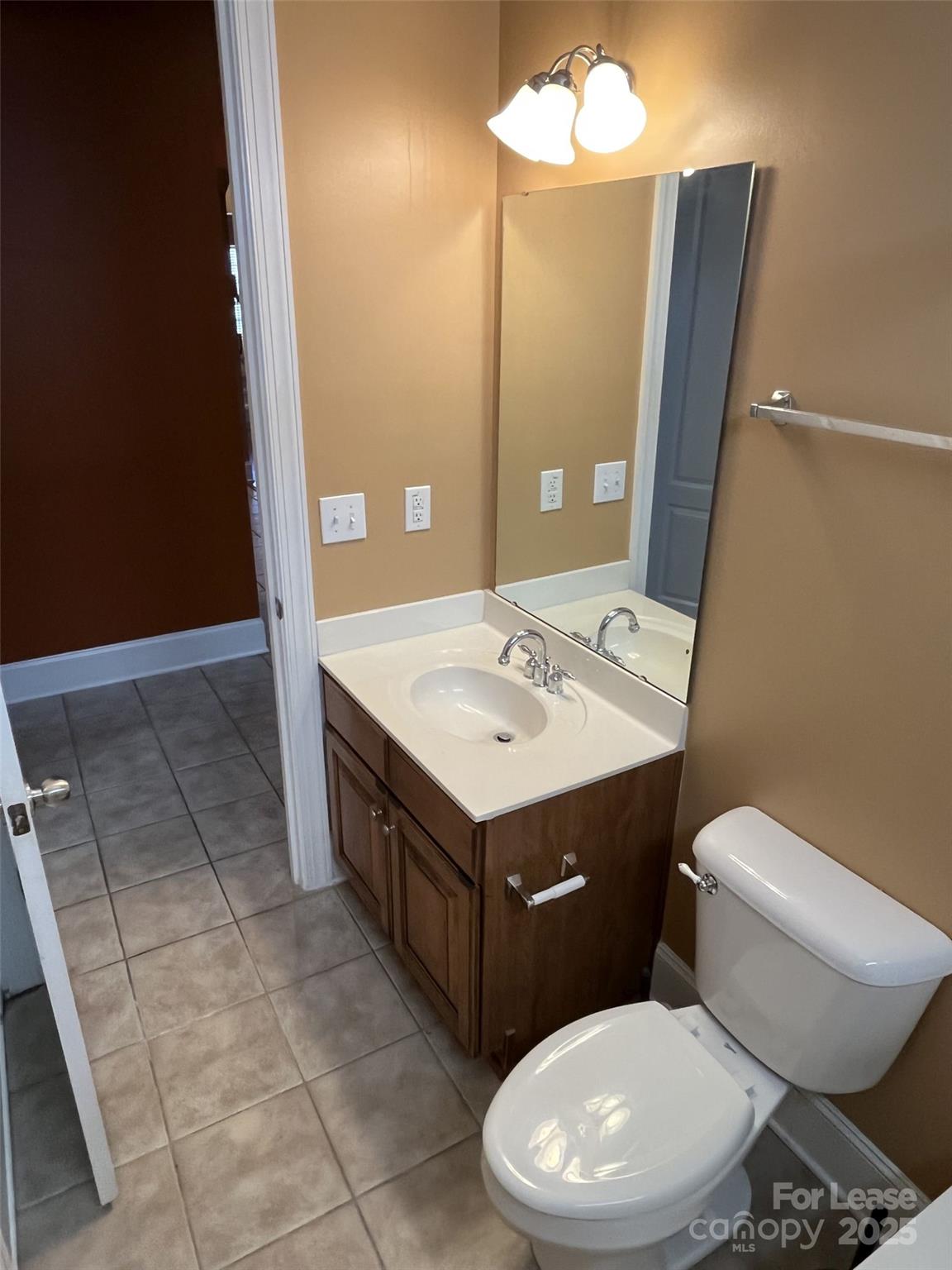 11502 Wheat Ridge Road Charlotte, NC 28277 - Photo 22 of 47 a bathroom with a sink vanity mirror and toilet
