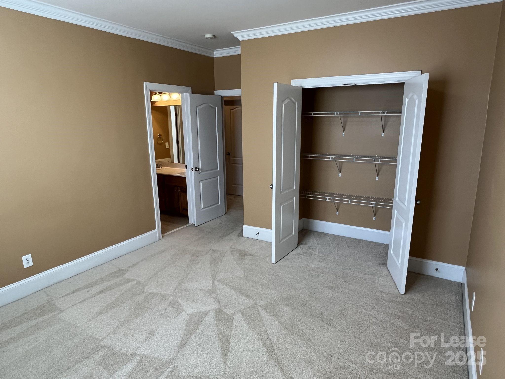 11502 Wheat Ridge Road Charlotte, NC 28277 - Photo 29 of 47 a view of an empty room with closet and a window