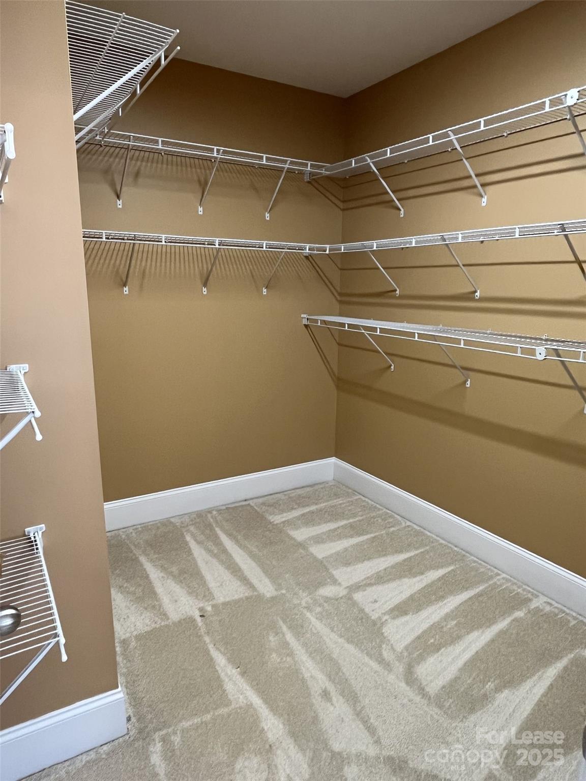 11502 Wheat Ridge Road Charlotte, NC 28277 - Photo 38 of 47 a view of a room with racks on the wall