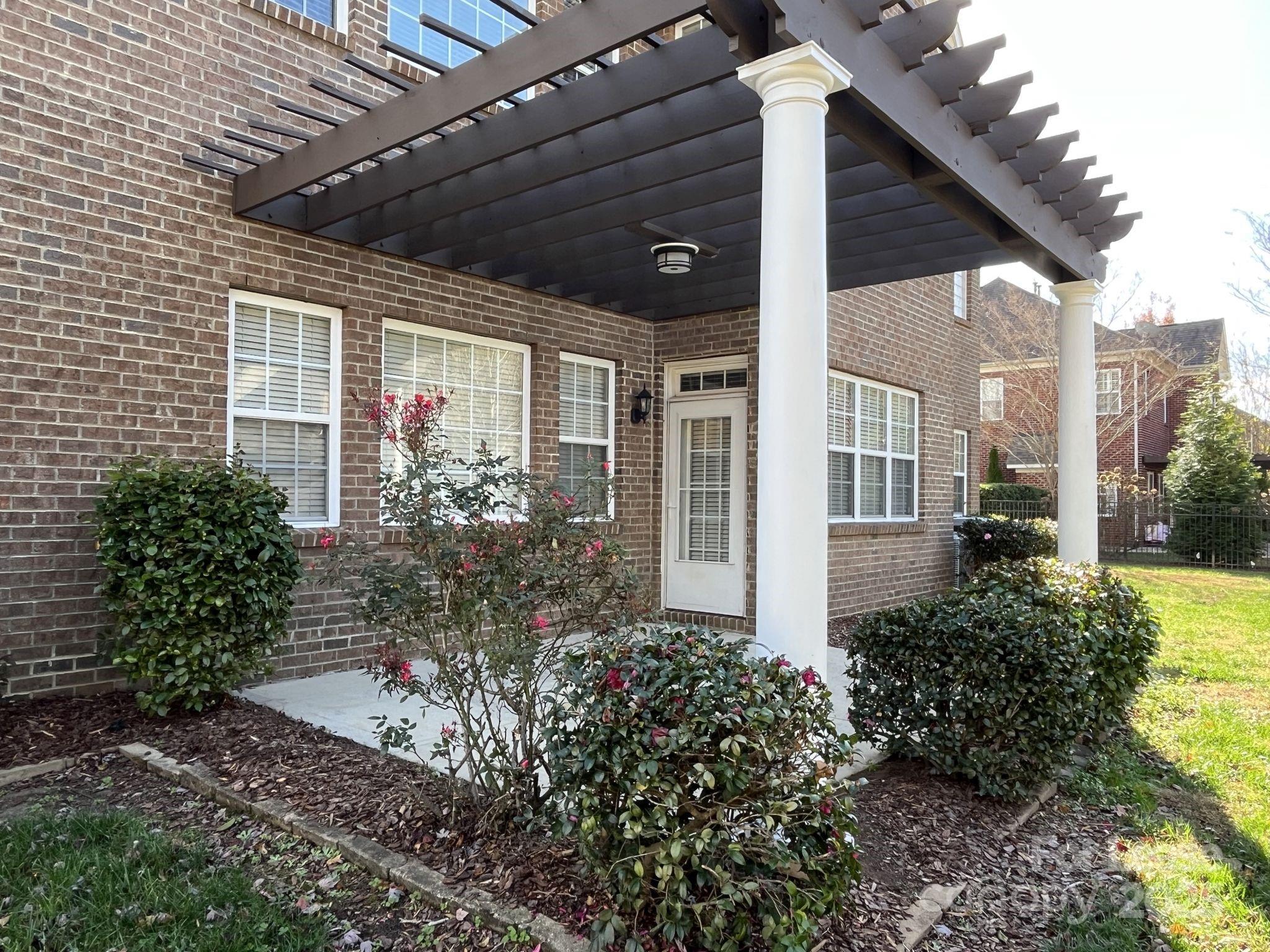 11502 Wheat Ridge Road Charlotte, NC 28277 - Photo 42 of 47 a view of a porch with garden
