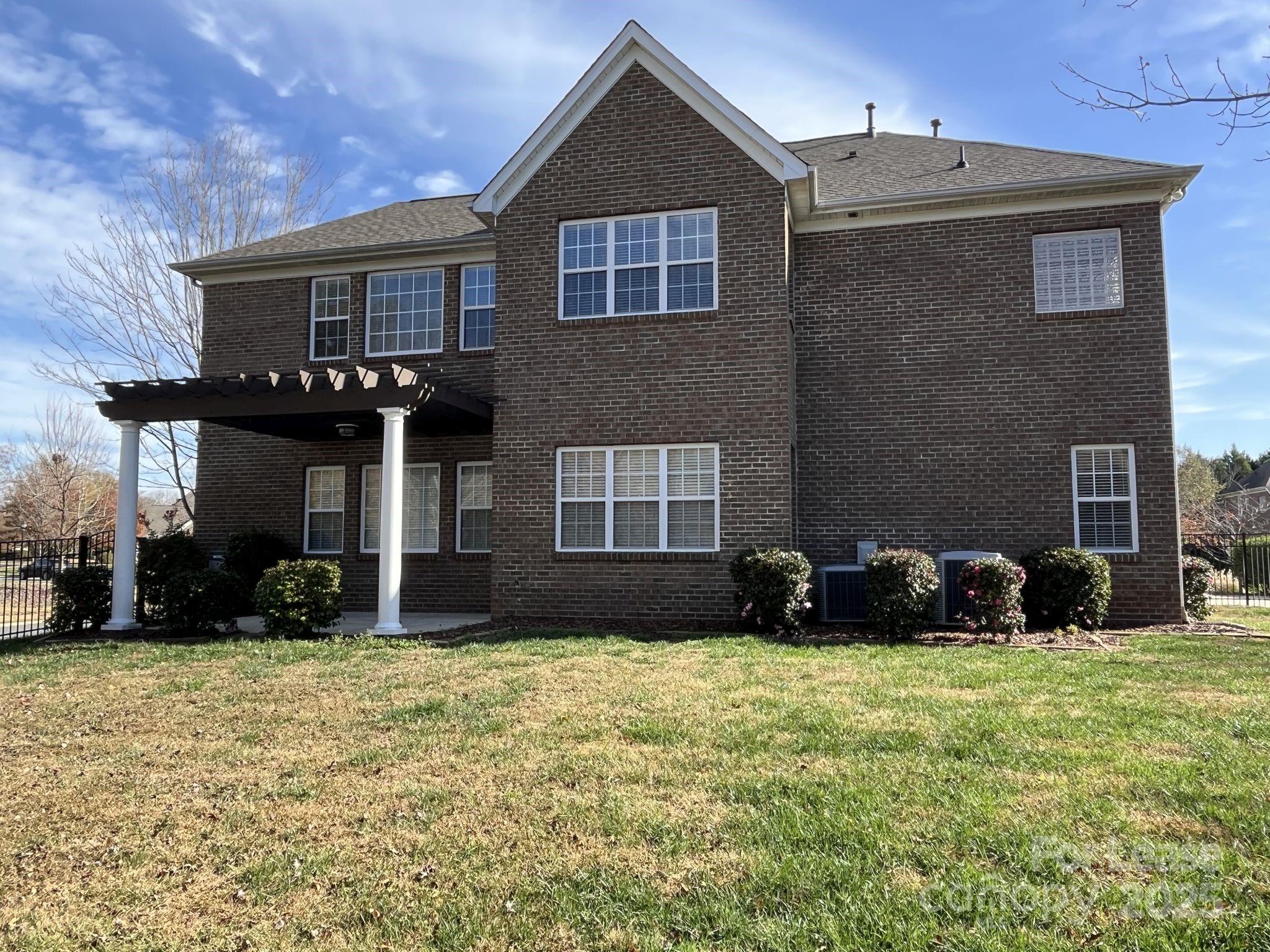 11502 Wheat Ridge Road Charlotte, NC 28277 - Photo 45 of 47 a front view of a house with a yard