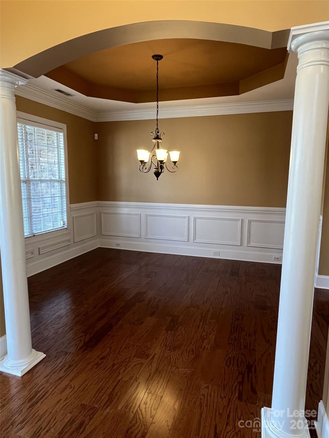 11502 Wheat Ridge Road Charlotte, NC 28277 - Photo 7 of 47 a view of a livingroom with wooden floor and a ceiling fan
