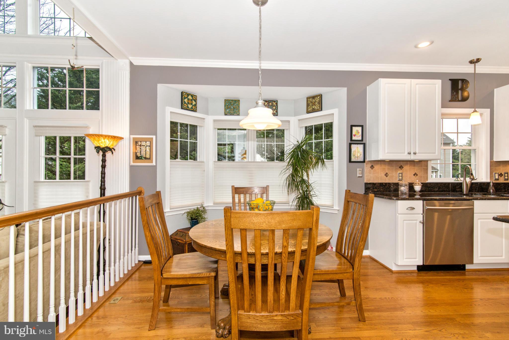 2519 Bear Den Road Frederick, MD 21701 - Photo 12 of 30 a view of a dining room with furniture window and wooden floor