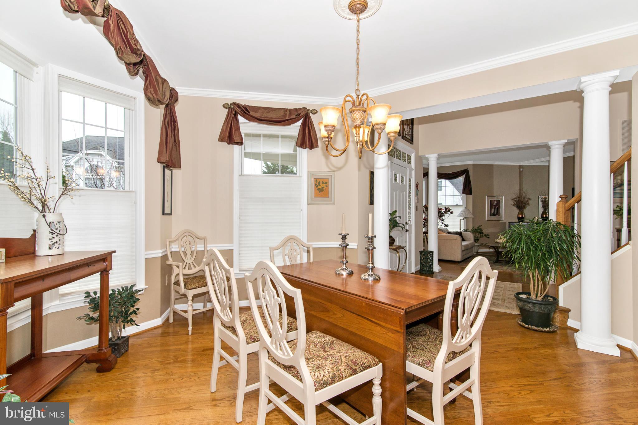 2519 Bear Den Road Frederick, MD 21701 - Photo 16 of 30 a view of a dining room with furniture window and wooden floor