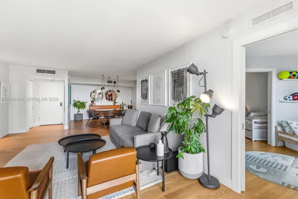 a living room with furniture and a table