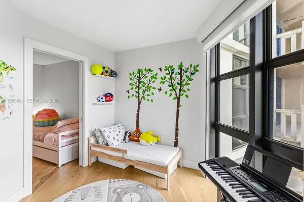 a bedroom with furniture and a window