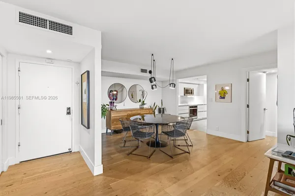 a view of a livingroom with furniture and a window