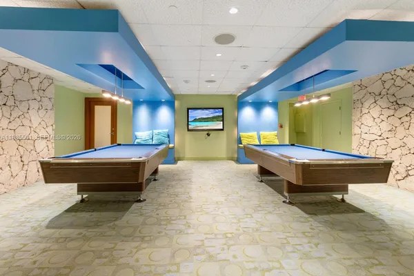 a swimming pool with outdoor seating