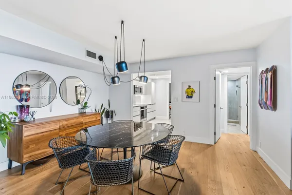 a dining room with furniture and window