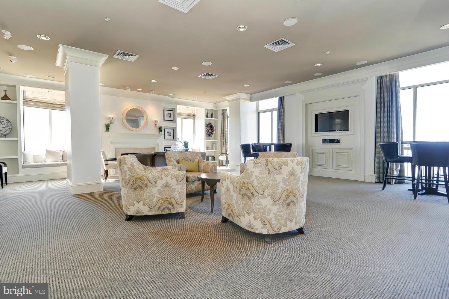 851 North Glebe Road, Unit 902 Arlington, VA 22203 - Photo 17 of 30 a living room with furniture and a large window