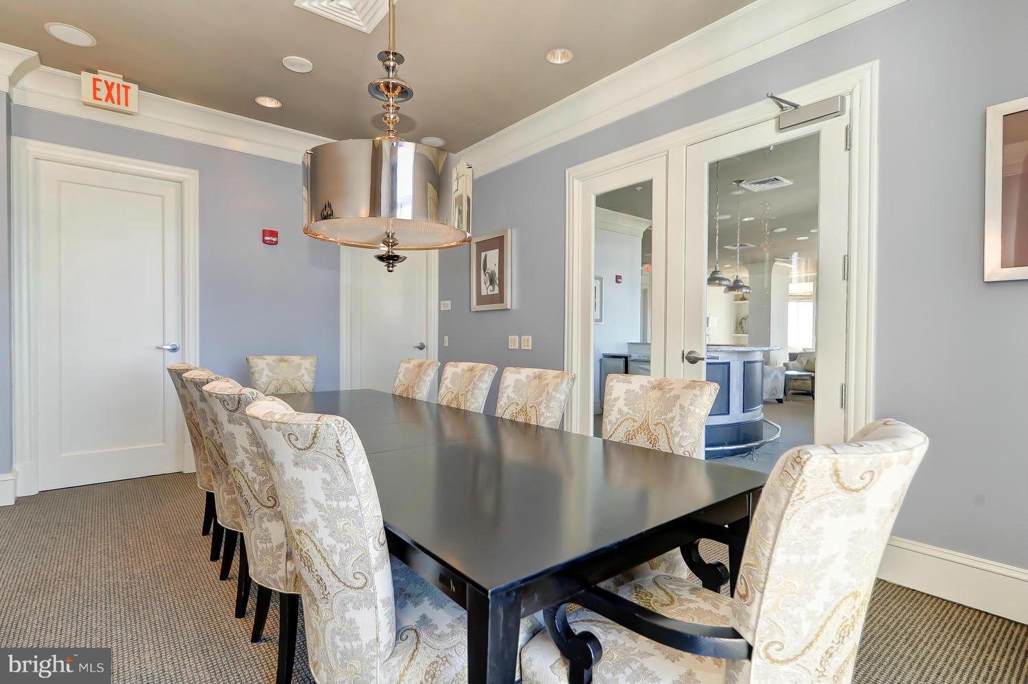 851 North Glebe Road, Unit 902 Arlington, VA 22203 - Photo 18 of 30 a view of a dining room with furniture and wooden floor