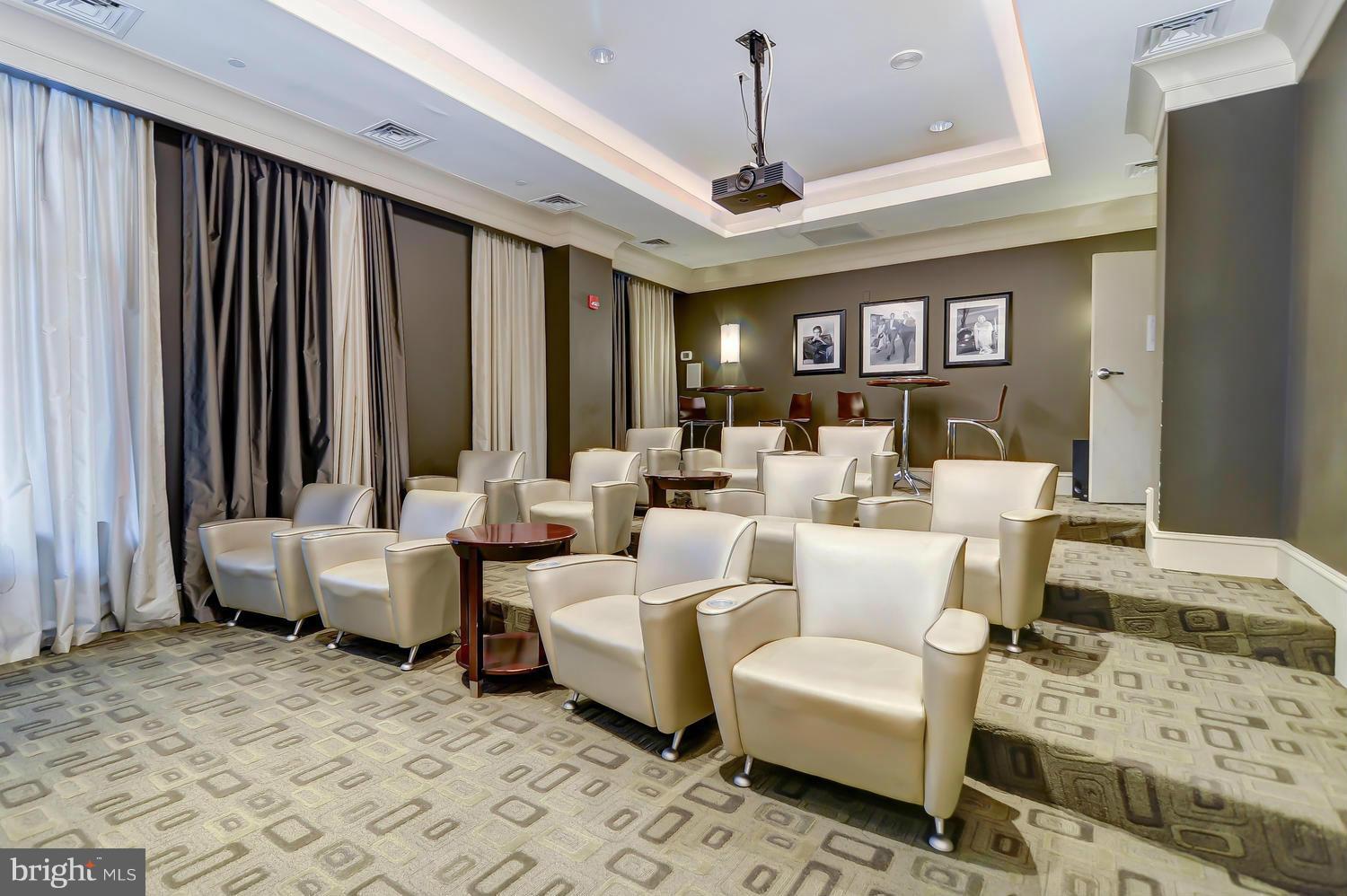 851 North Glebe Road, Unit 902 Arlington, VA 22203 - Photo 20 of 30 a living room with furniture and a chandelier